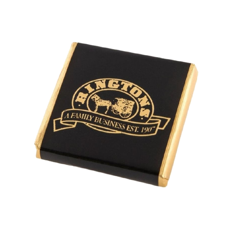 A dark chocolate Whittakers mint wrapped in gold foil and black paper witht he Ringtons logo in gold