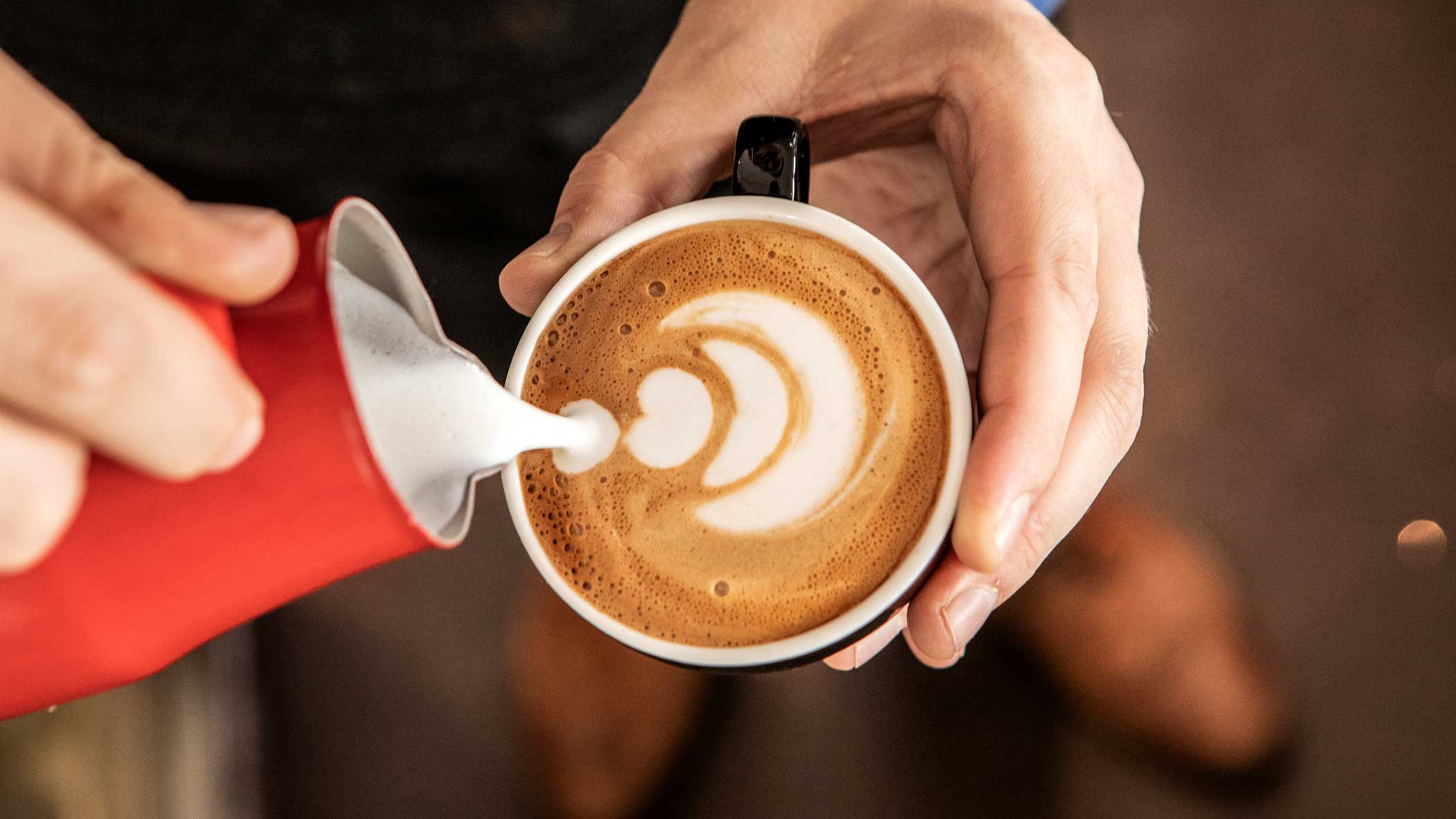 Barista pouring latte art