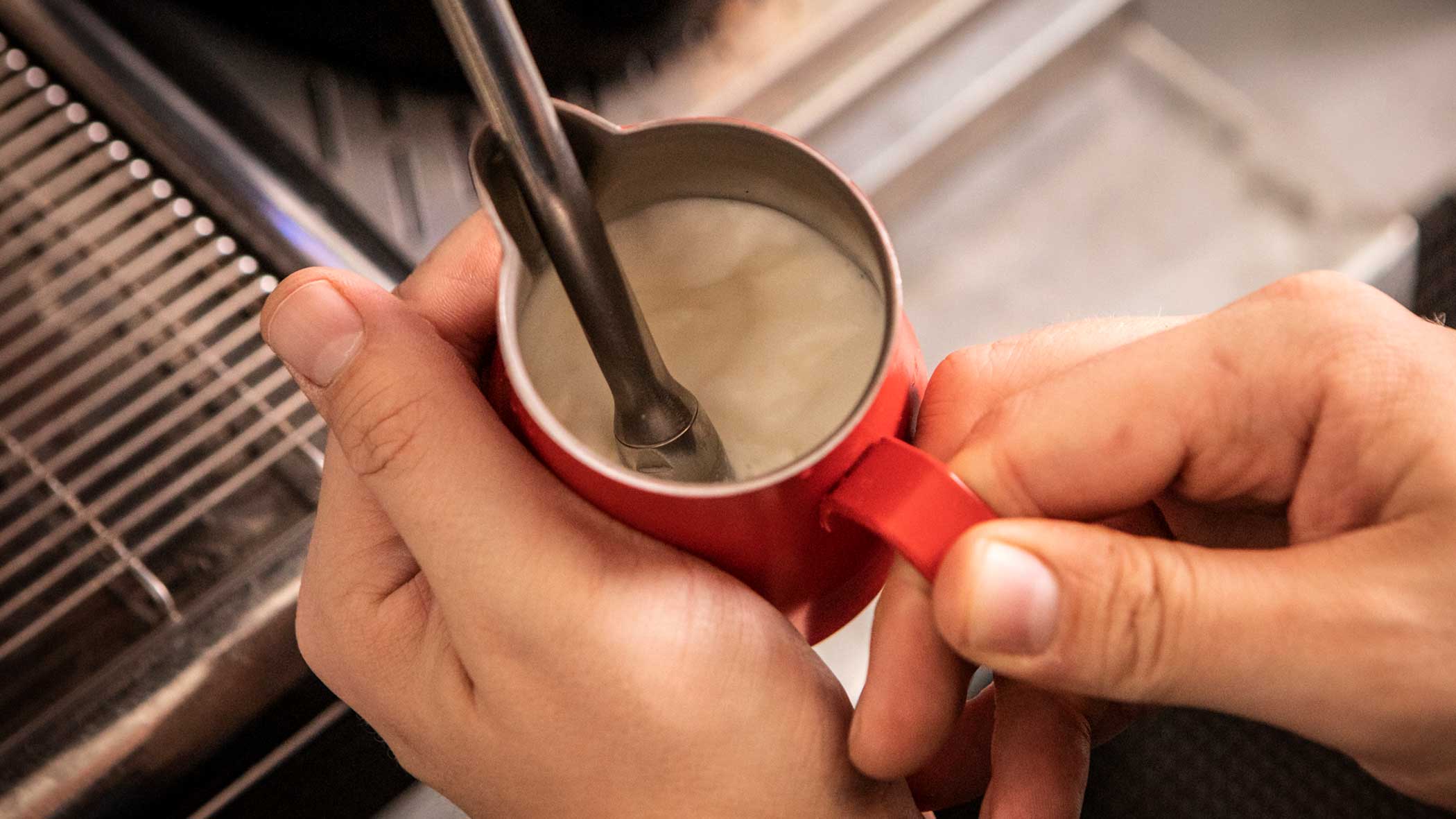 Milk jug steaming milk