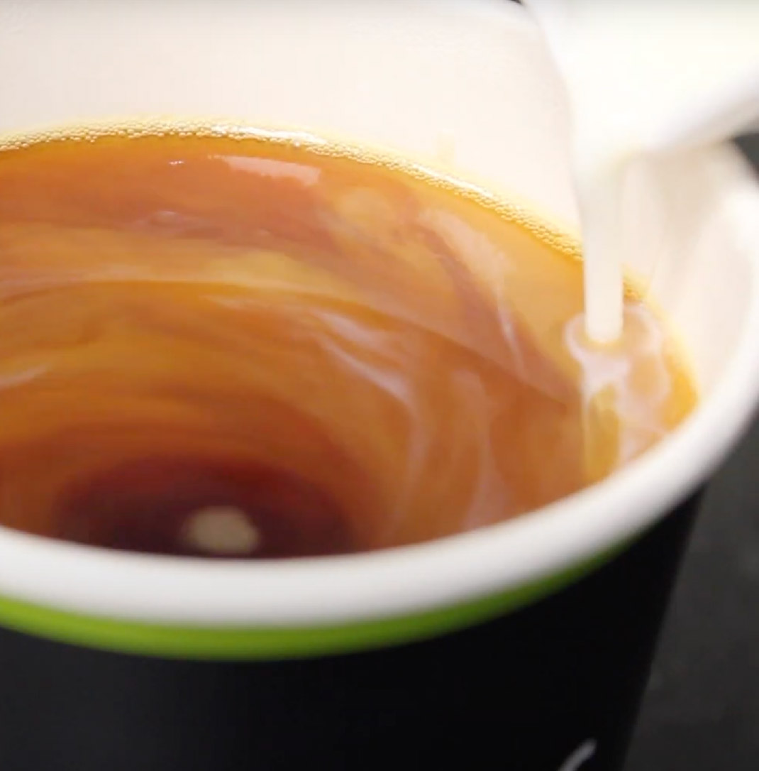 A disposable cup with tea inside