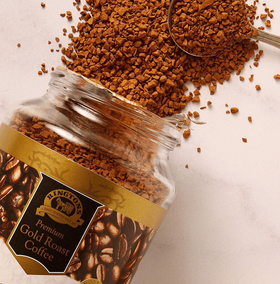 An open jar of Ringtons premium gold roast instant coffee