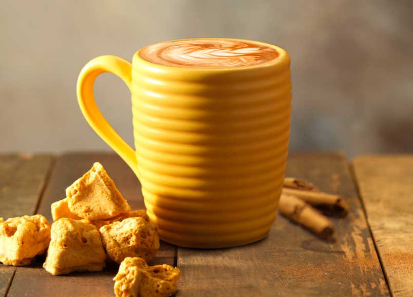 Cinnabee latte with honeycomb next to it